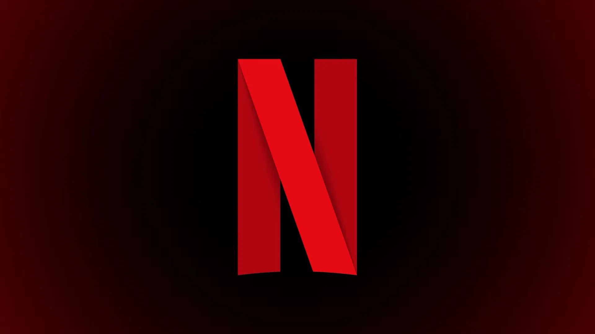 أيقونة Netflix على خلفية متدرجة باللونين الأسود والأحمر.