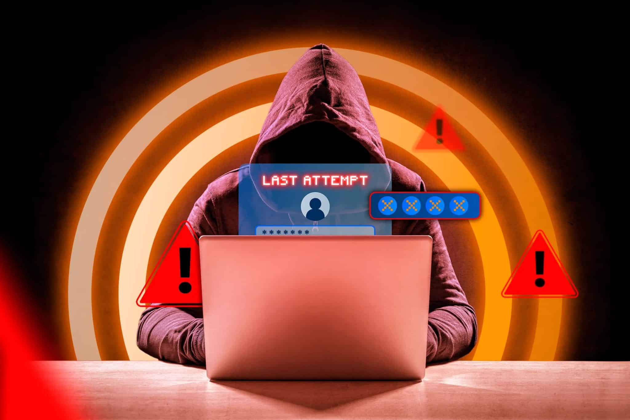 هاكر أمام جهاز كمبيوتر محمول مع نافذة تسجيل الدخول وبعض علامات التحذير حوله.