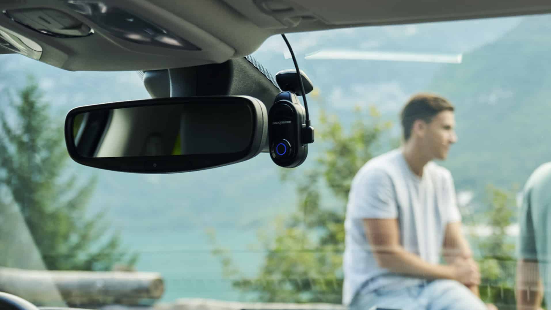 Nextbase Piqo dash cam attached to a car windscreen