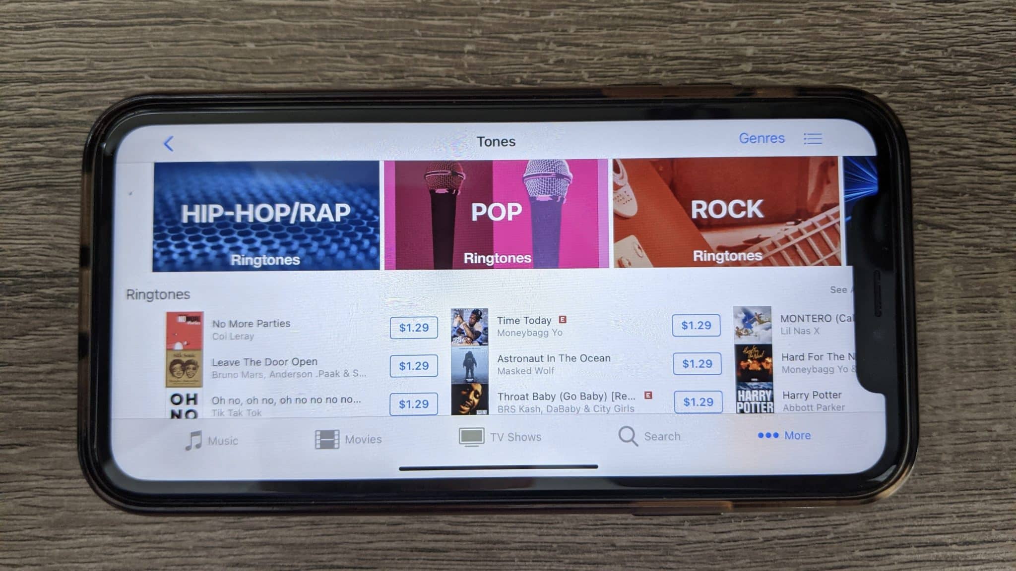 An iPhone 10R showing the Apple iTunes Store's ringtones selection