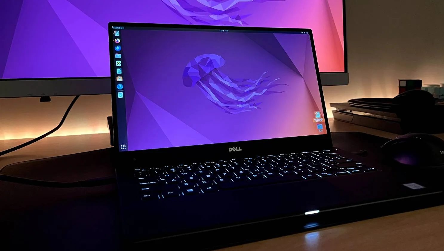 Dell XPS 13 running Ubuntu with a monitor in the background