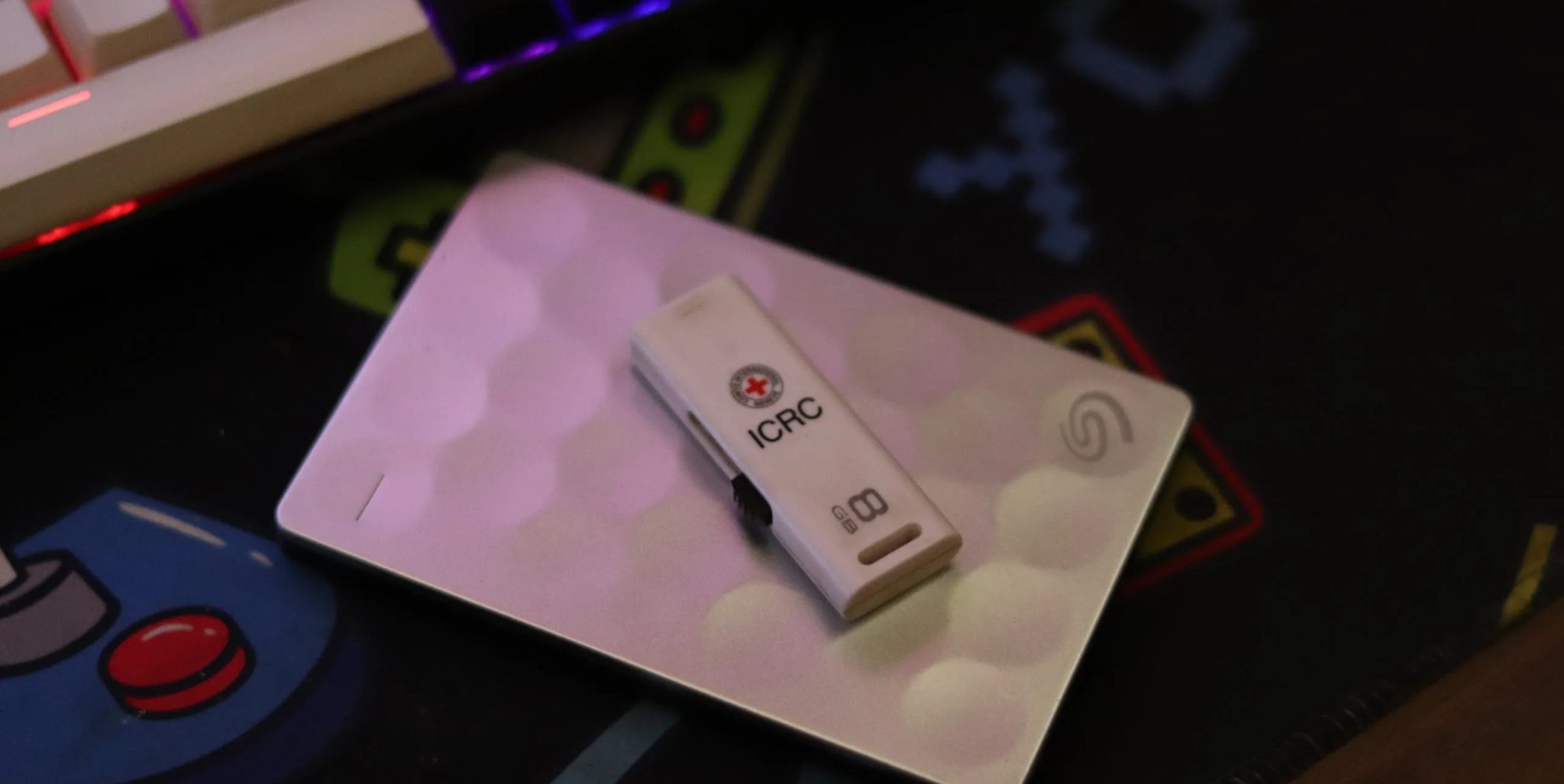 External SSD and USB drive on a mousepad