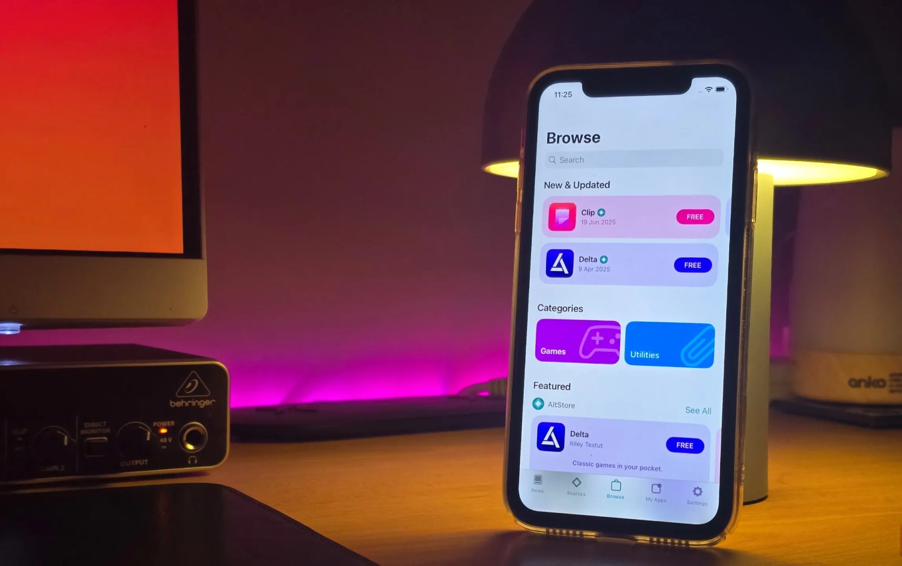iPhone on a table running AltStore