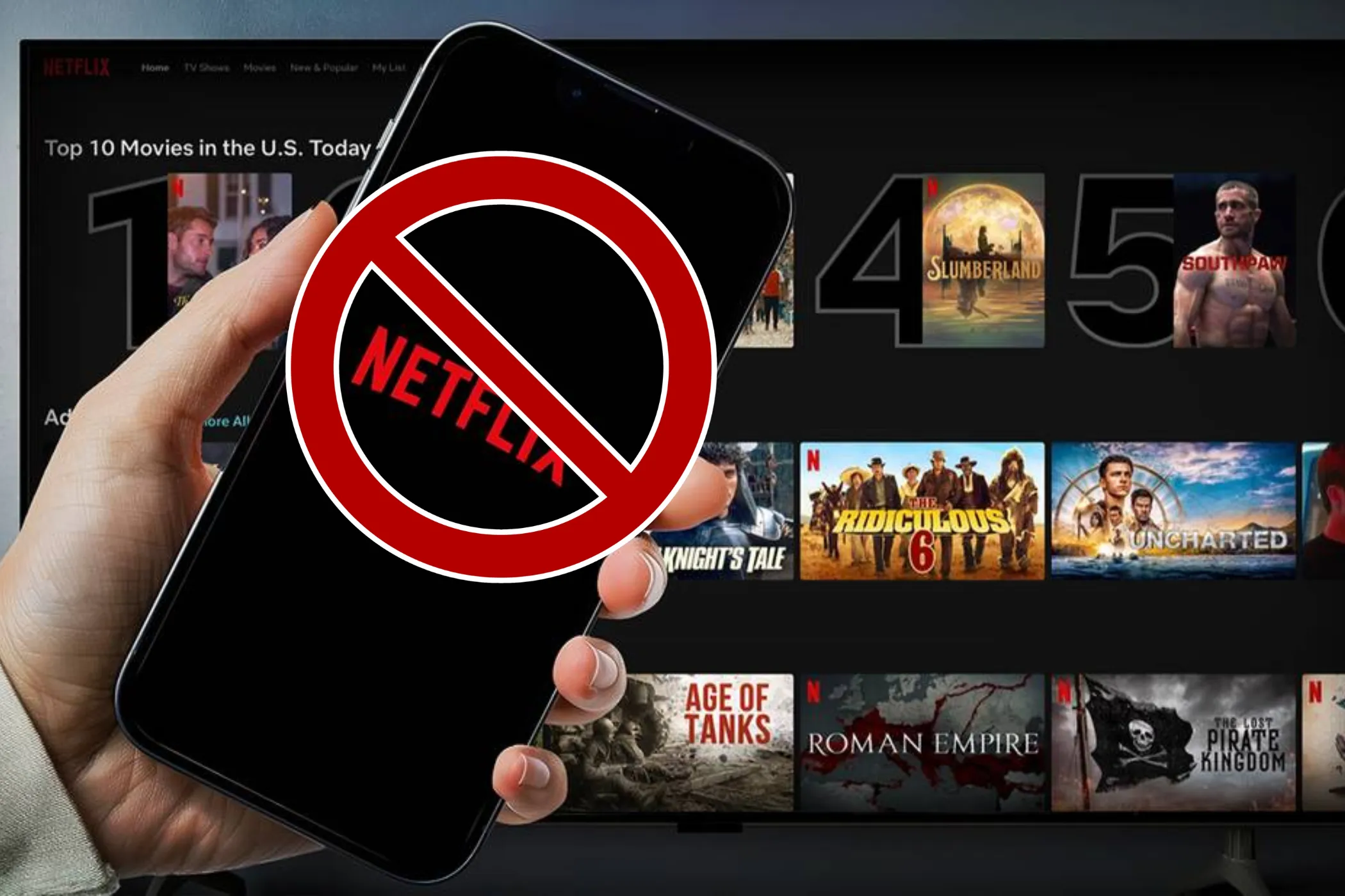 رمز الإلغاء موضوع على يد تحمل هاتفًا يعرض شعار Netflix مع الشاشة الرئيسية لـ Netflix في الخلفية