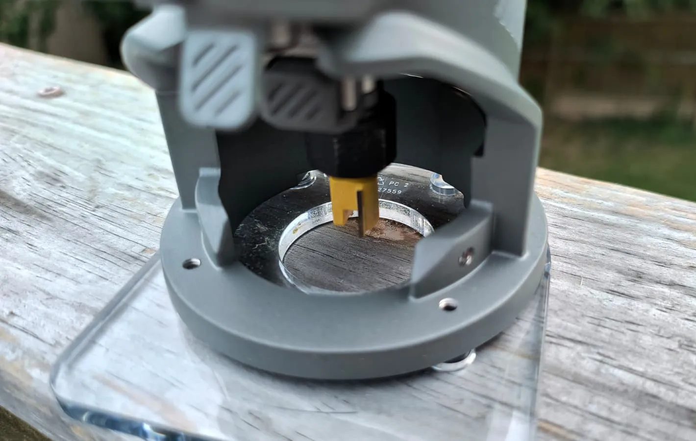 A router bit attached to the inside of a router