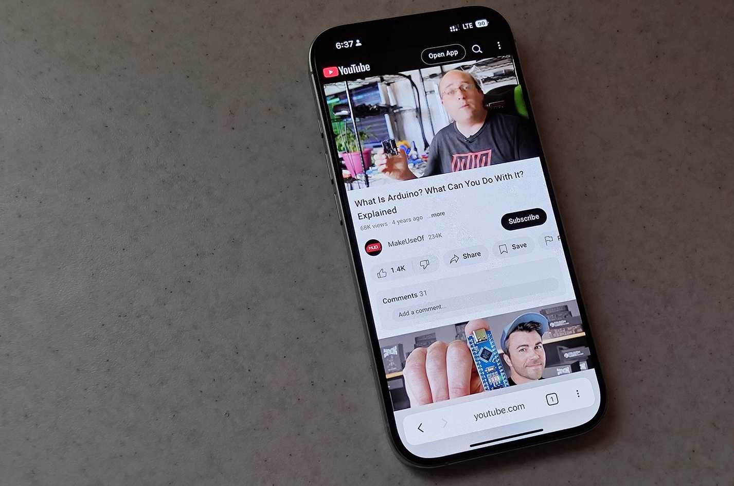 An iPhone with the YouTube web app open