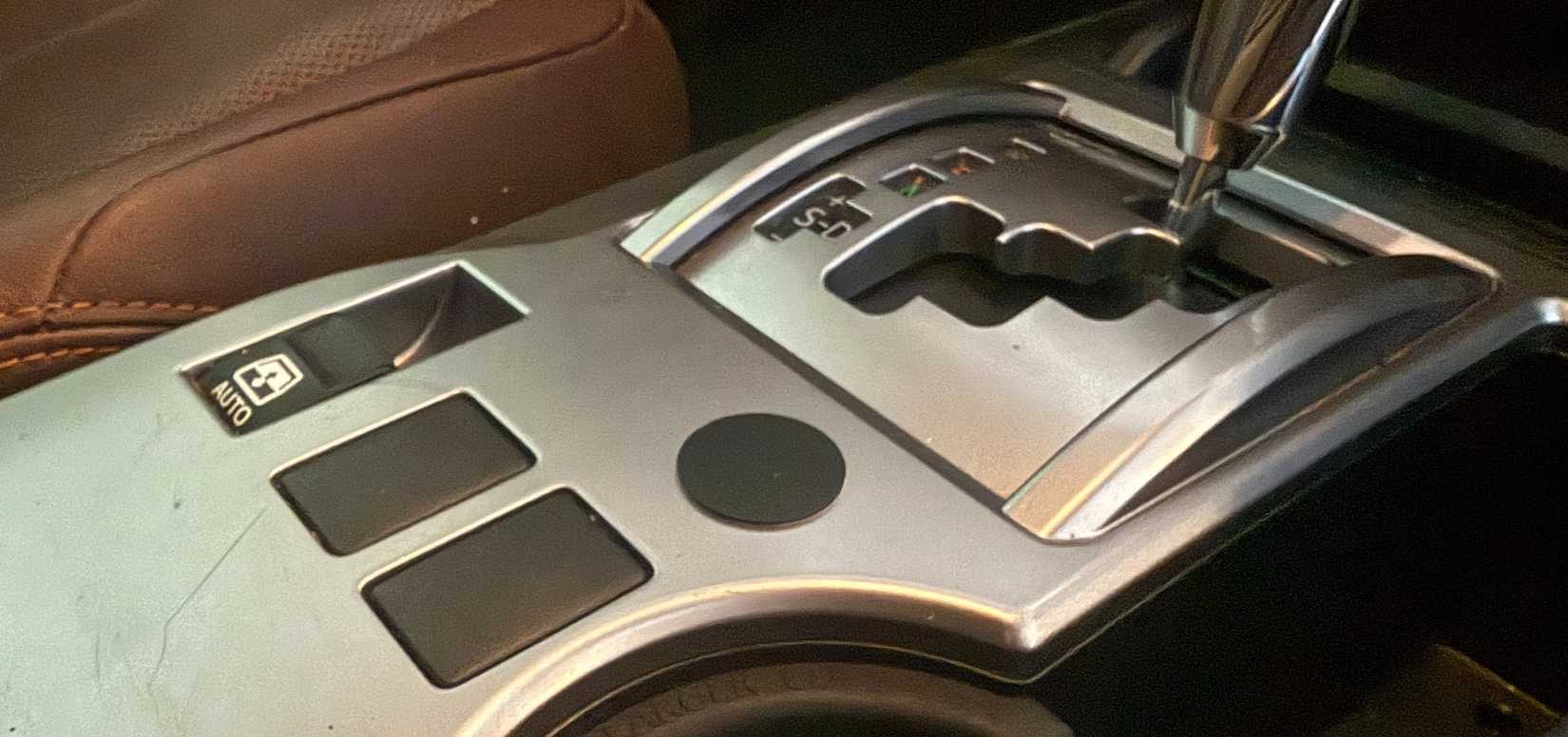 black nfc tag on car center console-1