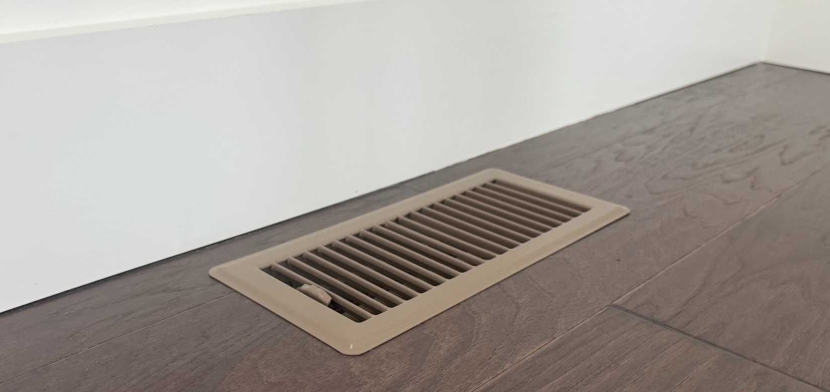 brown floor air vent on wood floor