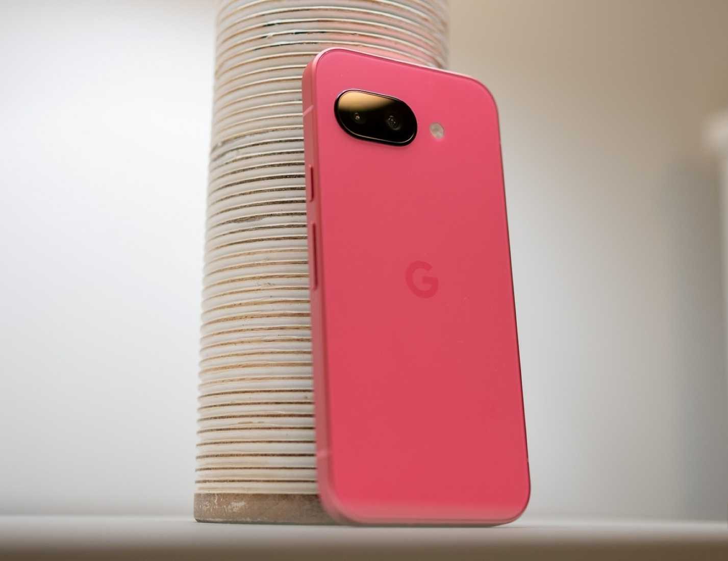 Google Pixel 9a sitting on a table showing the back of the phone