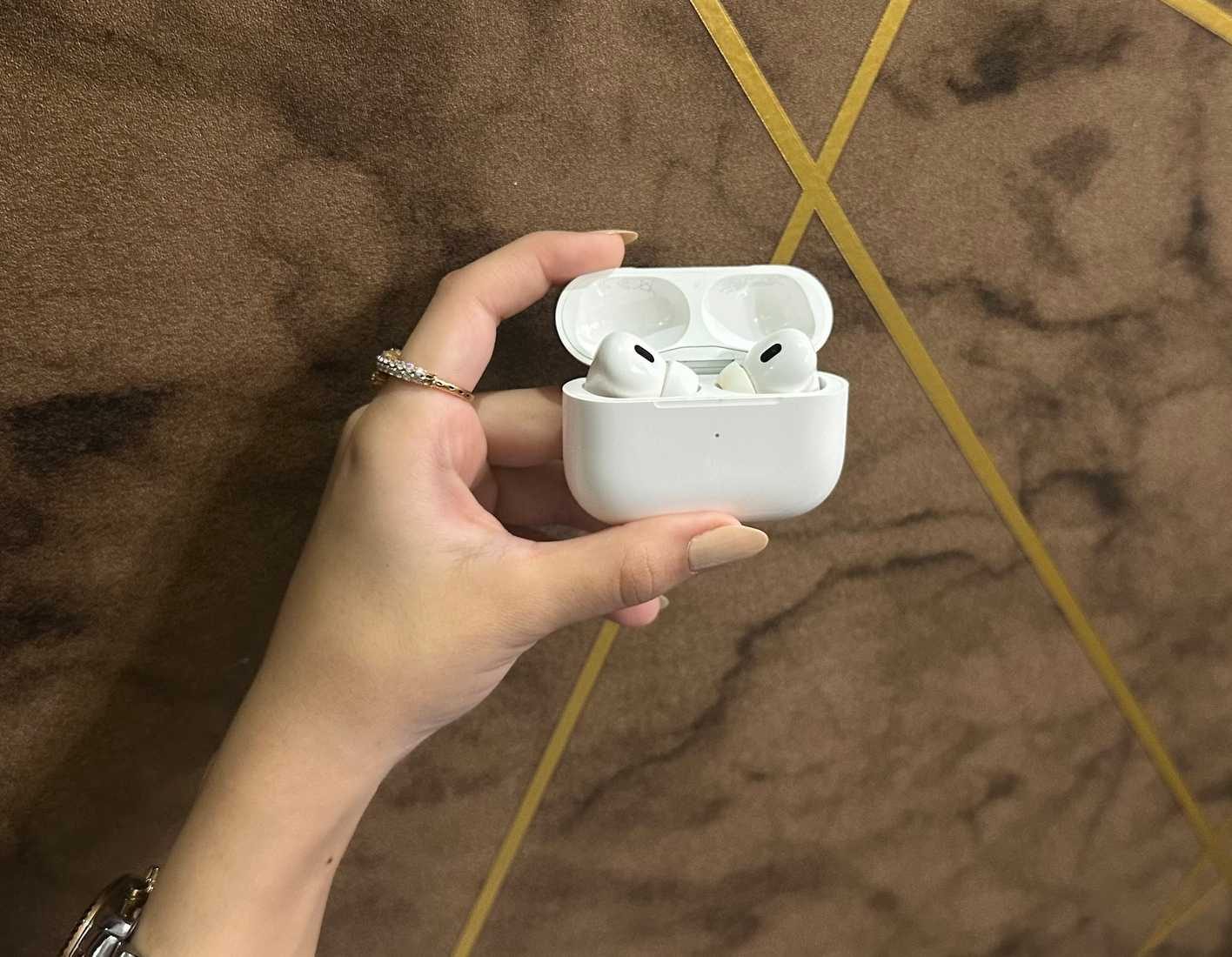 Holding the AirPods Pro 2nd Generation case