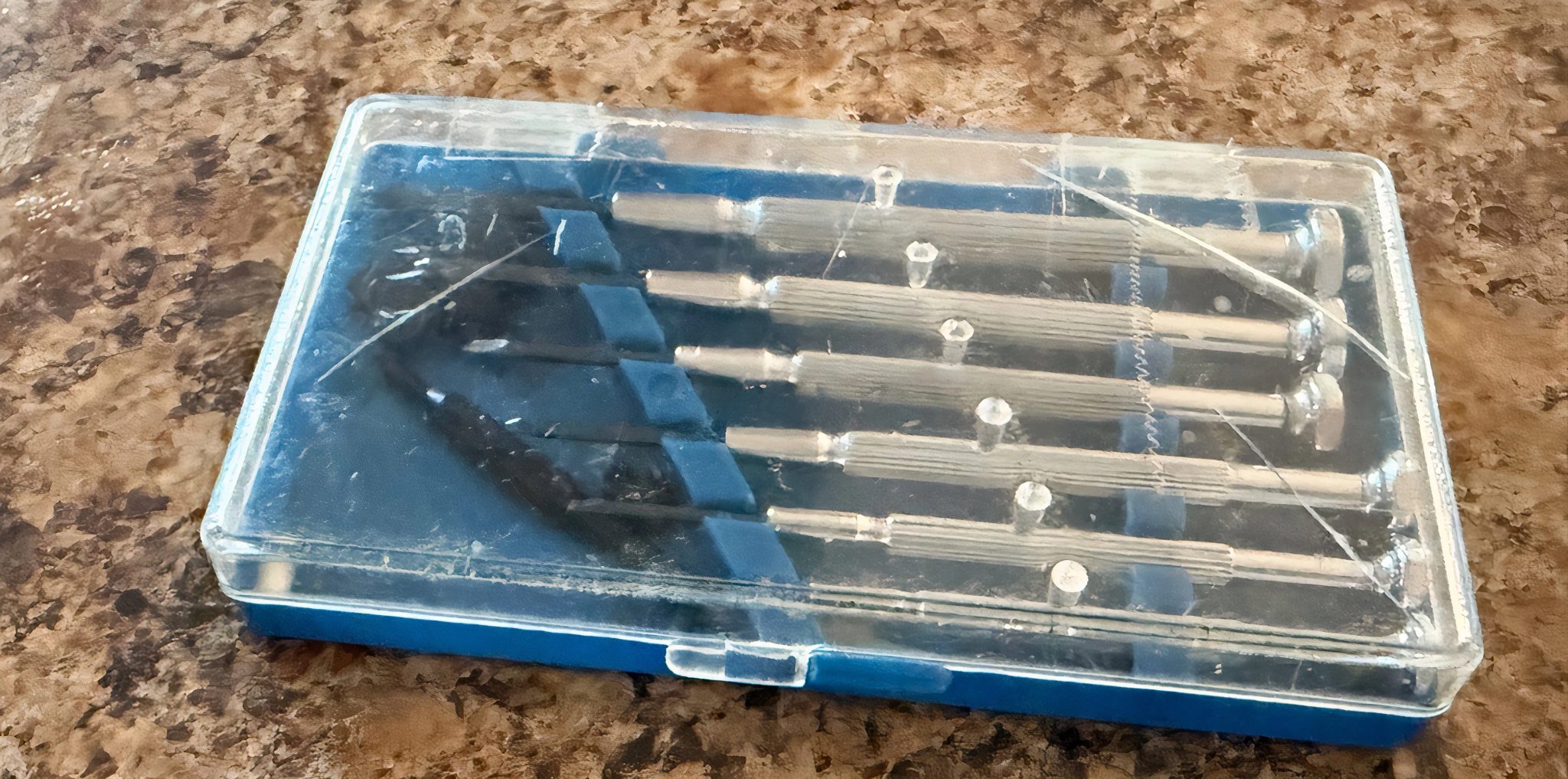 A case filled with tiny household screwdrivers.
