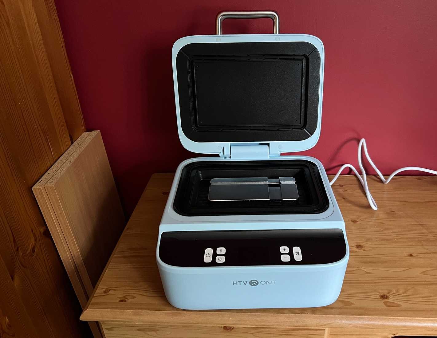 HTVRont phone Case Heat Press with universal phone holder inside.