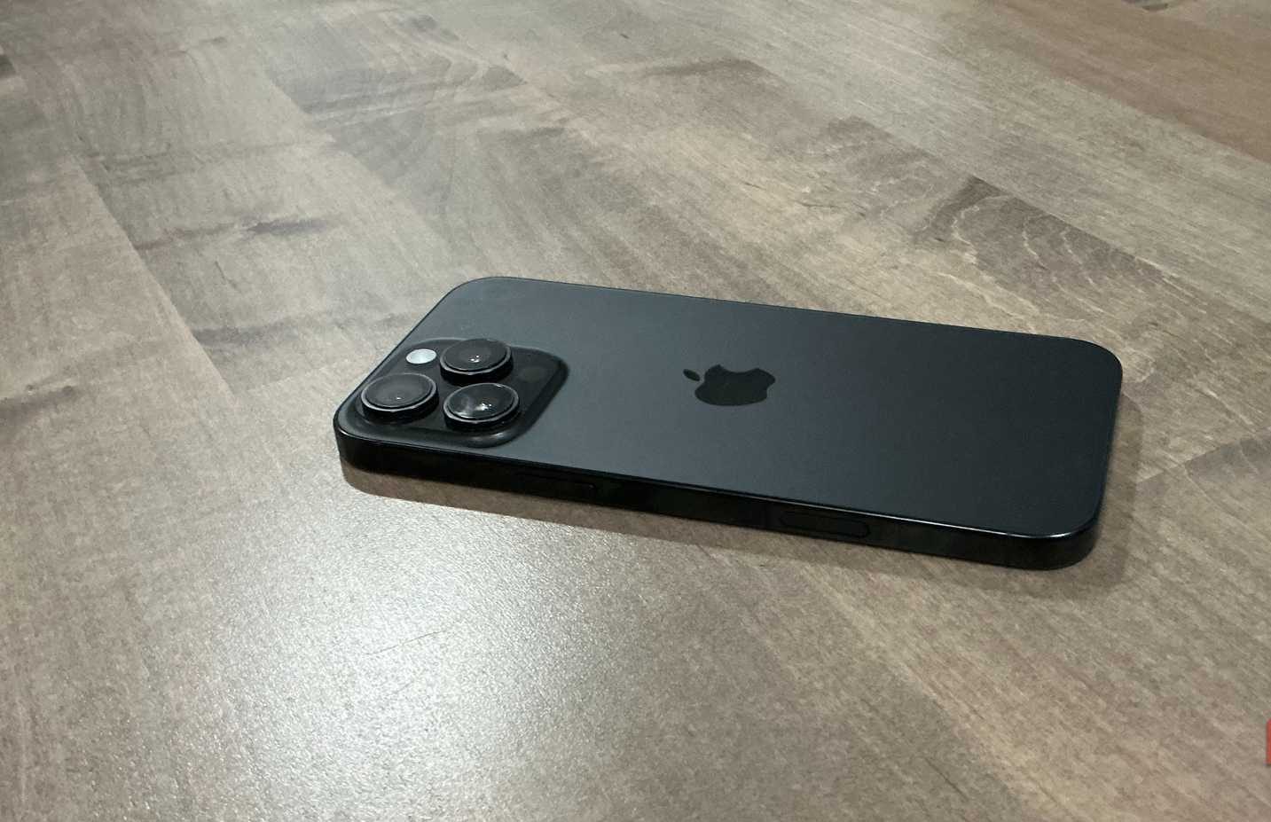 iphone pro max 16 back on wooden desk