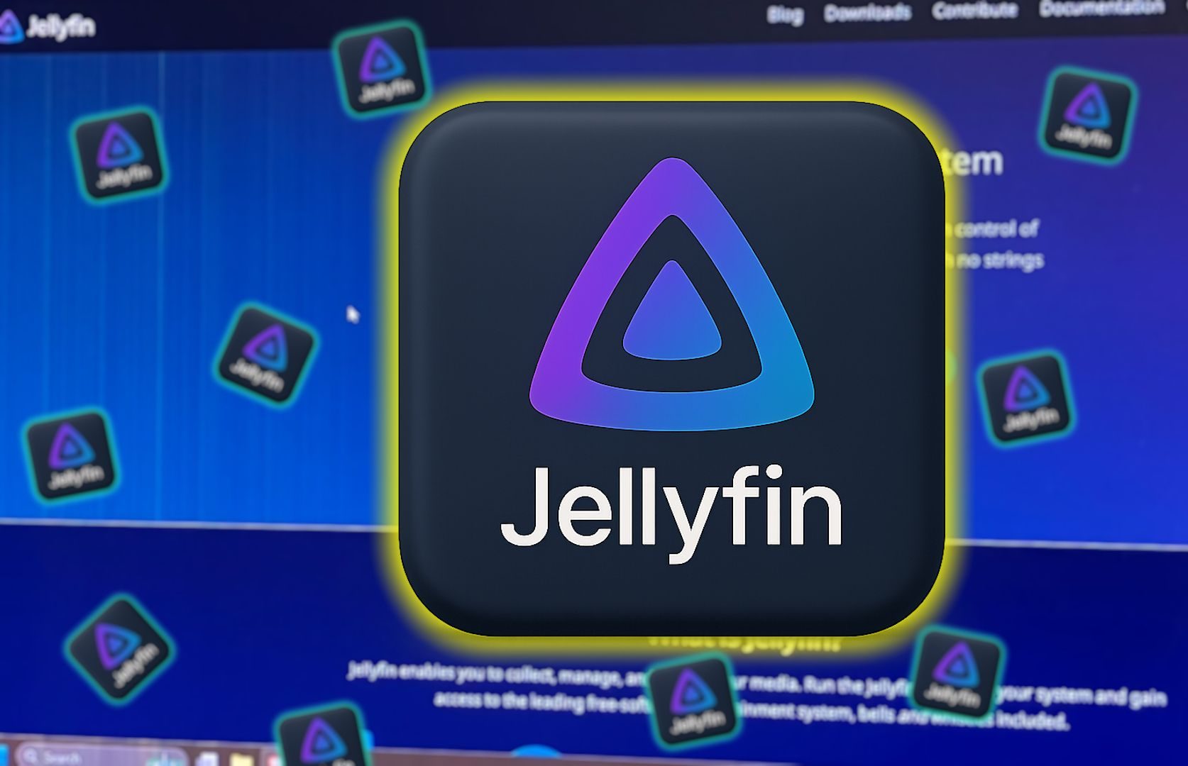 شعار Jellyfin مع خلفية موقع Jellyfin على شاشة الكمبيوتر.
