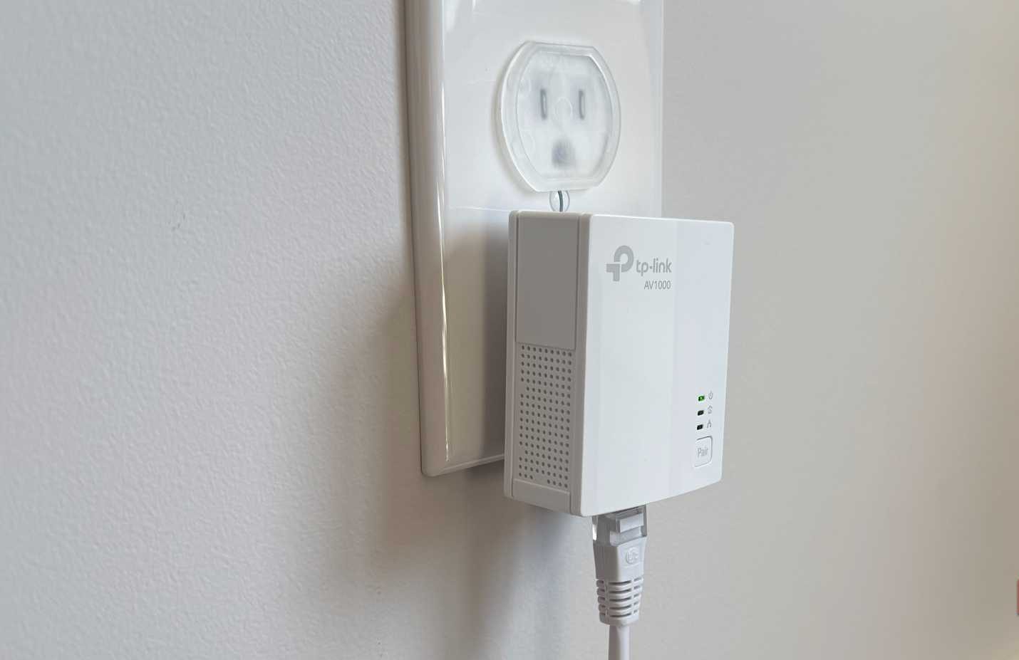 powerline adapter in bedroom plugged into wall socket