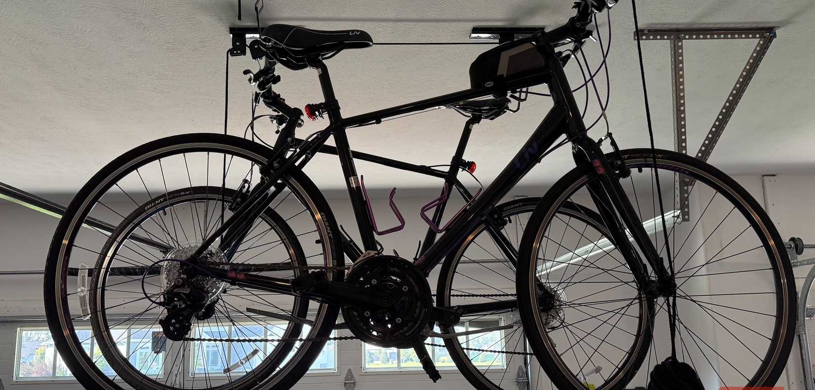 two bikes suspending from garage ceiling