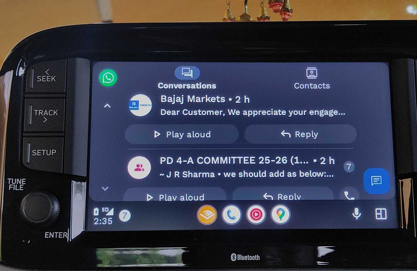 WhatsApp home screen with multiple messages visible with an option to real aloud on Android Auto.