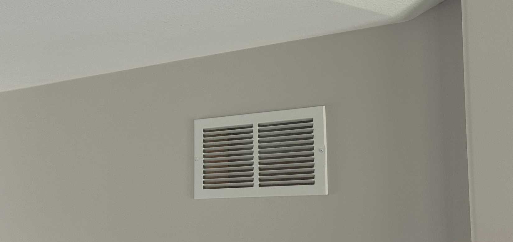 white return air vent near ceiling