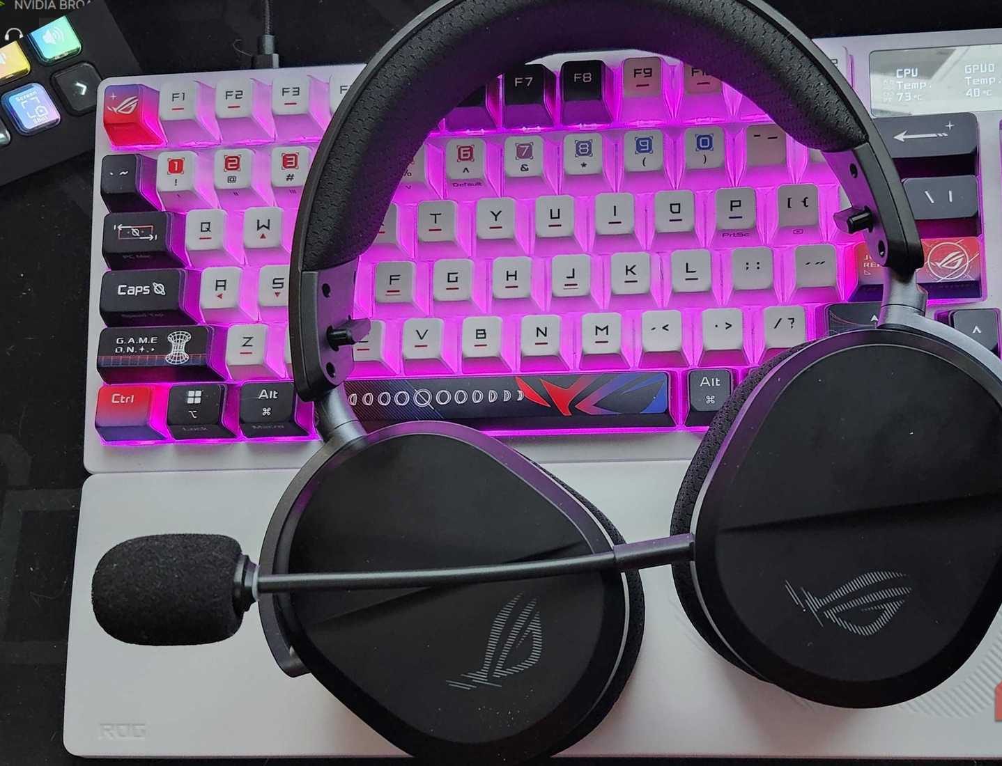 ASUS Pelta II Headphones on top of an ASUS keyboard