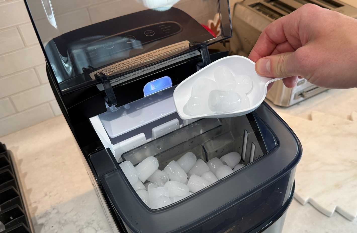 govee smart ice maker filled with ice and scoop