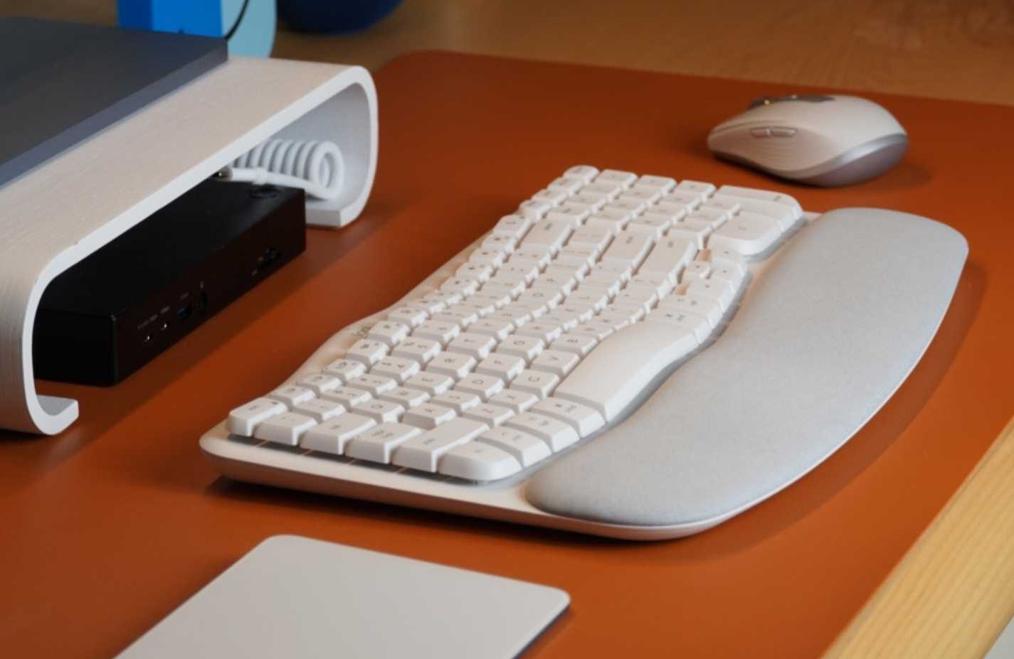 A wide shot of the Logitech Wave Keys ergonomic keyboard on a desk.
